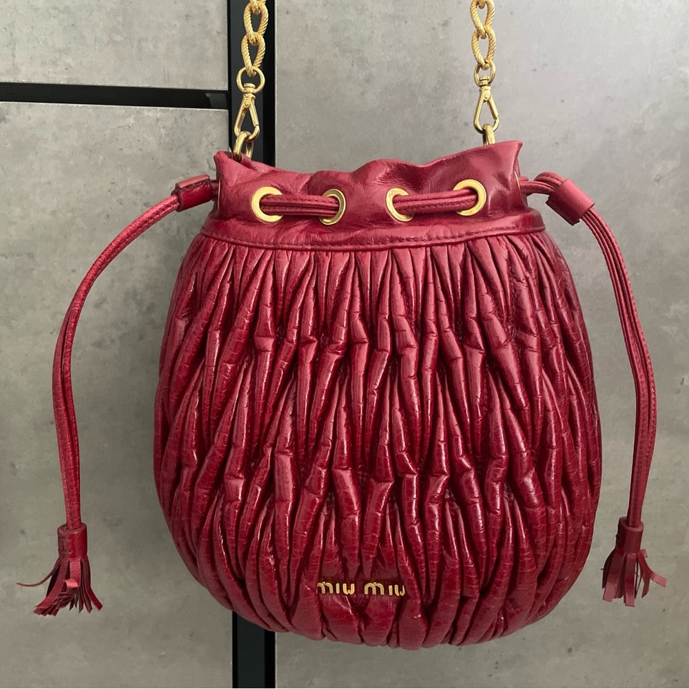 Miu Miu leather bag with detachable gold strap. Red